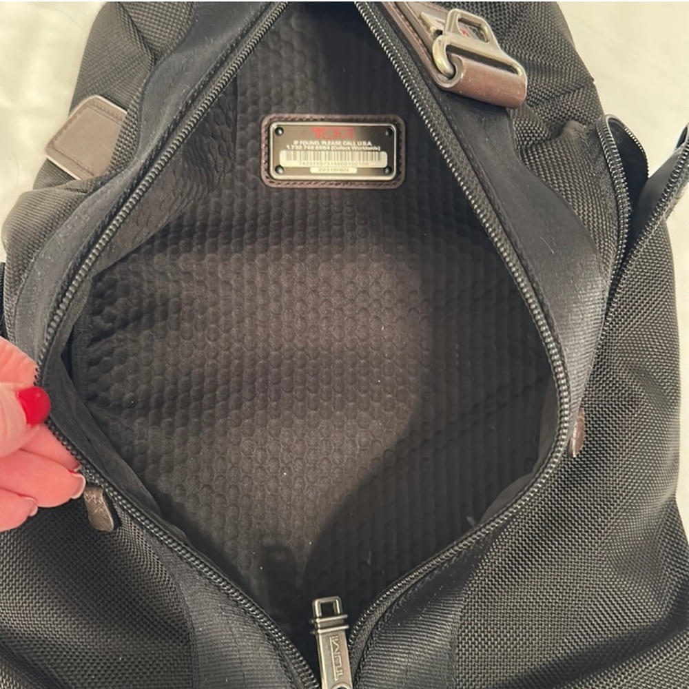 Tumi sling bag. Used but in EXCELLENT good condition! LIKE NEW!